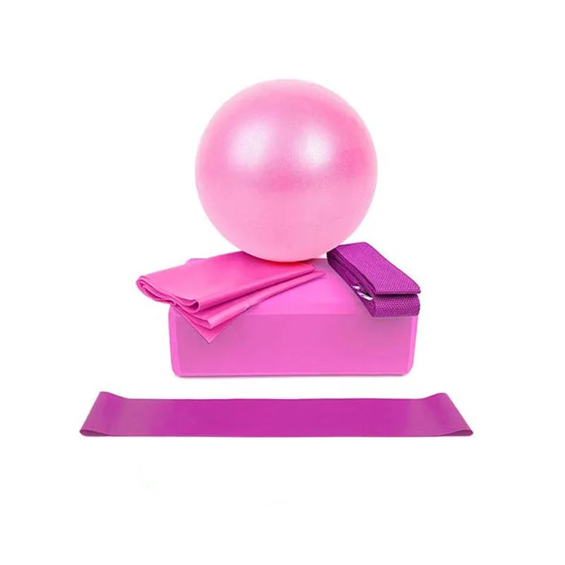 Pink exercise ball, resistance band, and foam roller on a white background
