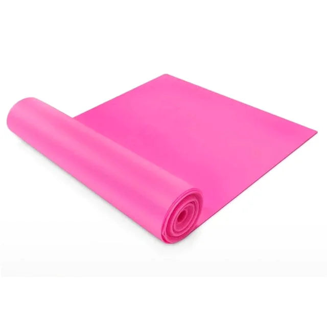 Pink yoga mat rolled up on a white background