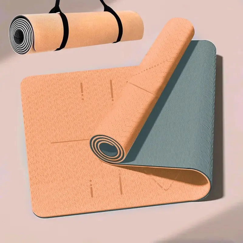 Two rolled-up yoga mats, one beige and one with a blue gradient, on a light pink background.