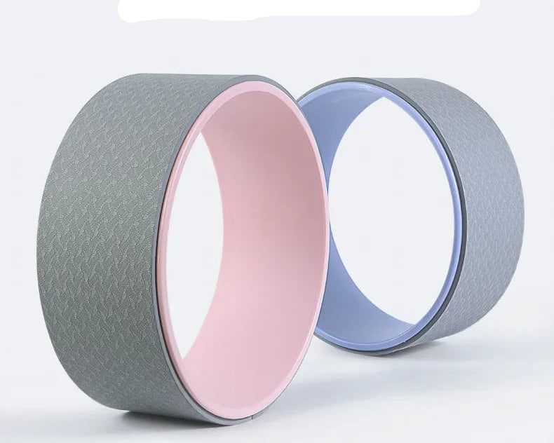 Yoga wheel with gray and pink design on a white background