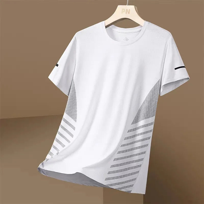 White t-shirt with black geometric patterns on a hanger against a brown background