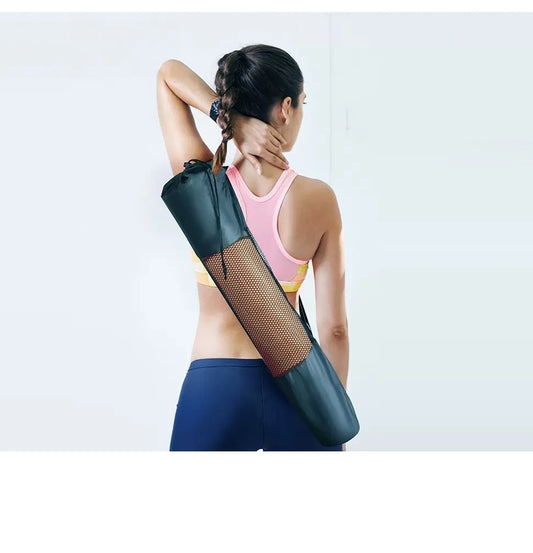 Woman using a black mesh yoga mat bag on a white background