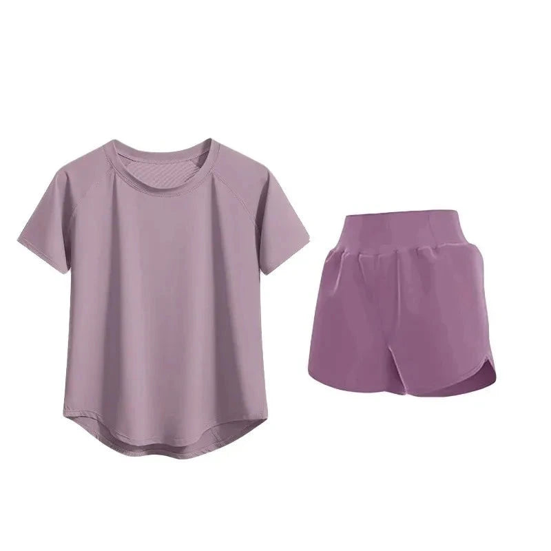 Purple fitness uniform set with t-shirt and shorts on a white background
