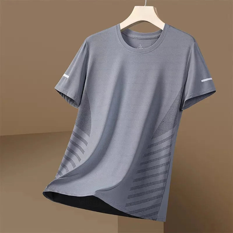 Gray t-shirt with a subtle pattern on a hanger against a brown background