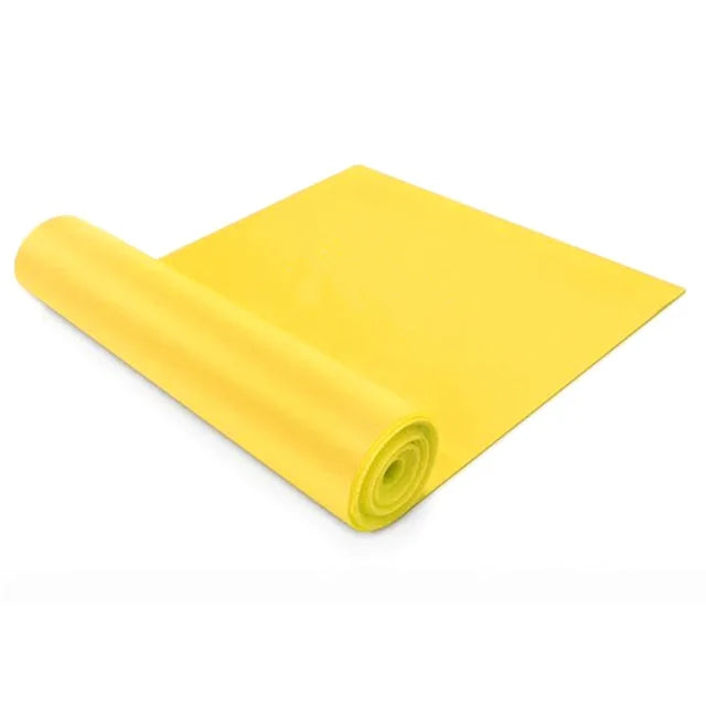 Yellow yoga mat rolled up on a white background
