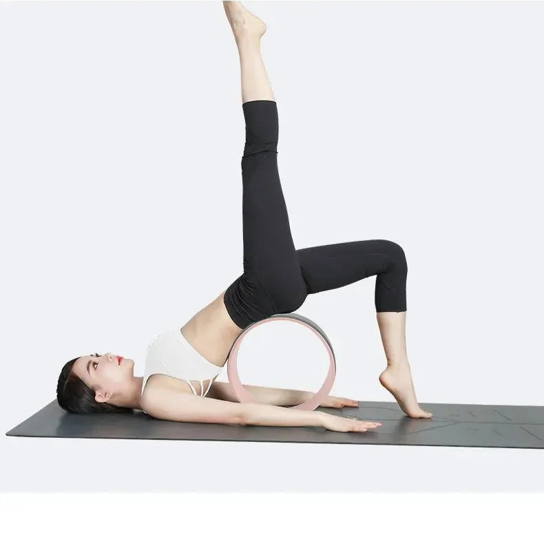Person practicing yoga with a ring on a white background, text about benefits of yoga.