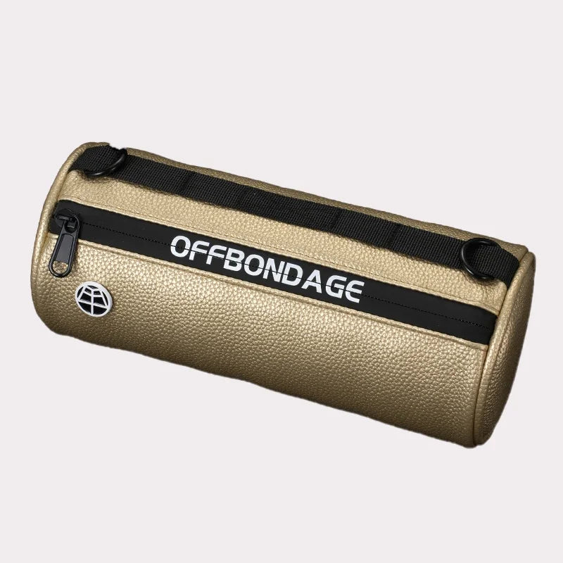 Gold cylindrical bag with black strap and 'OFFBONDAGE' branding on a light gray background