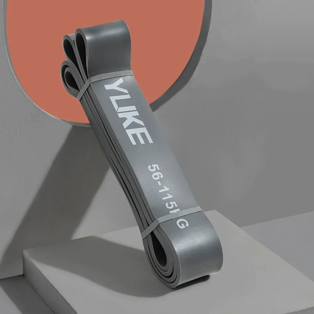 Gray resistance band with 'YUKE' branding on a gray background