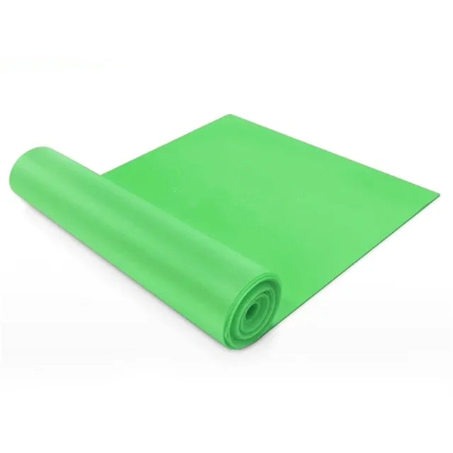 Green yoga mat rolled up on a white background