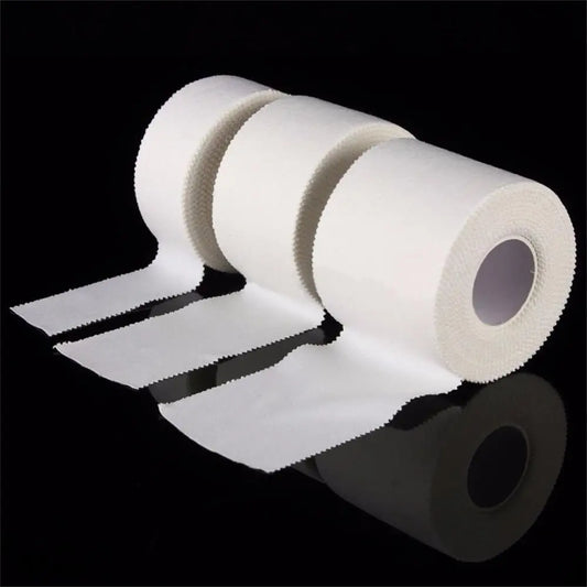 Roll of white paper tape with a clear background