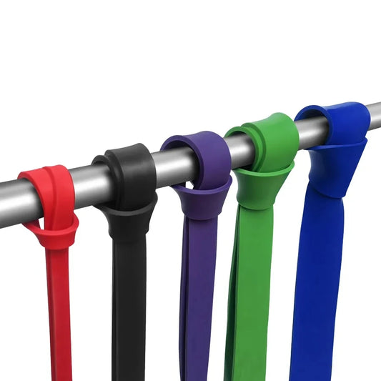 Set of colorful resistance bands on a white background