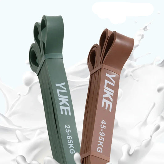 Two resistance bands, one green and one brown, with 'YLIKE' branding on a white background.