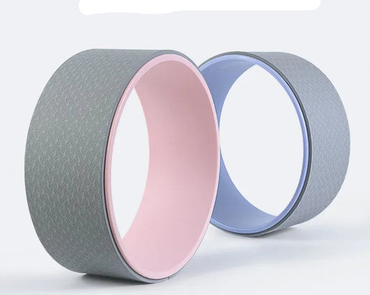 Yoga wheel with gray and pink design on a white background