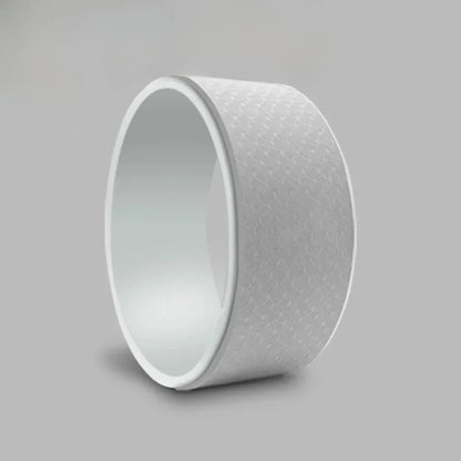 White cylindrical object with textured surface on a gray background