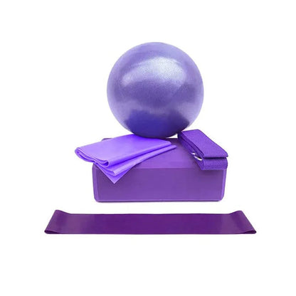 Purple exercise ball, block, and resistance band on a white background