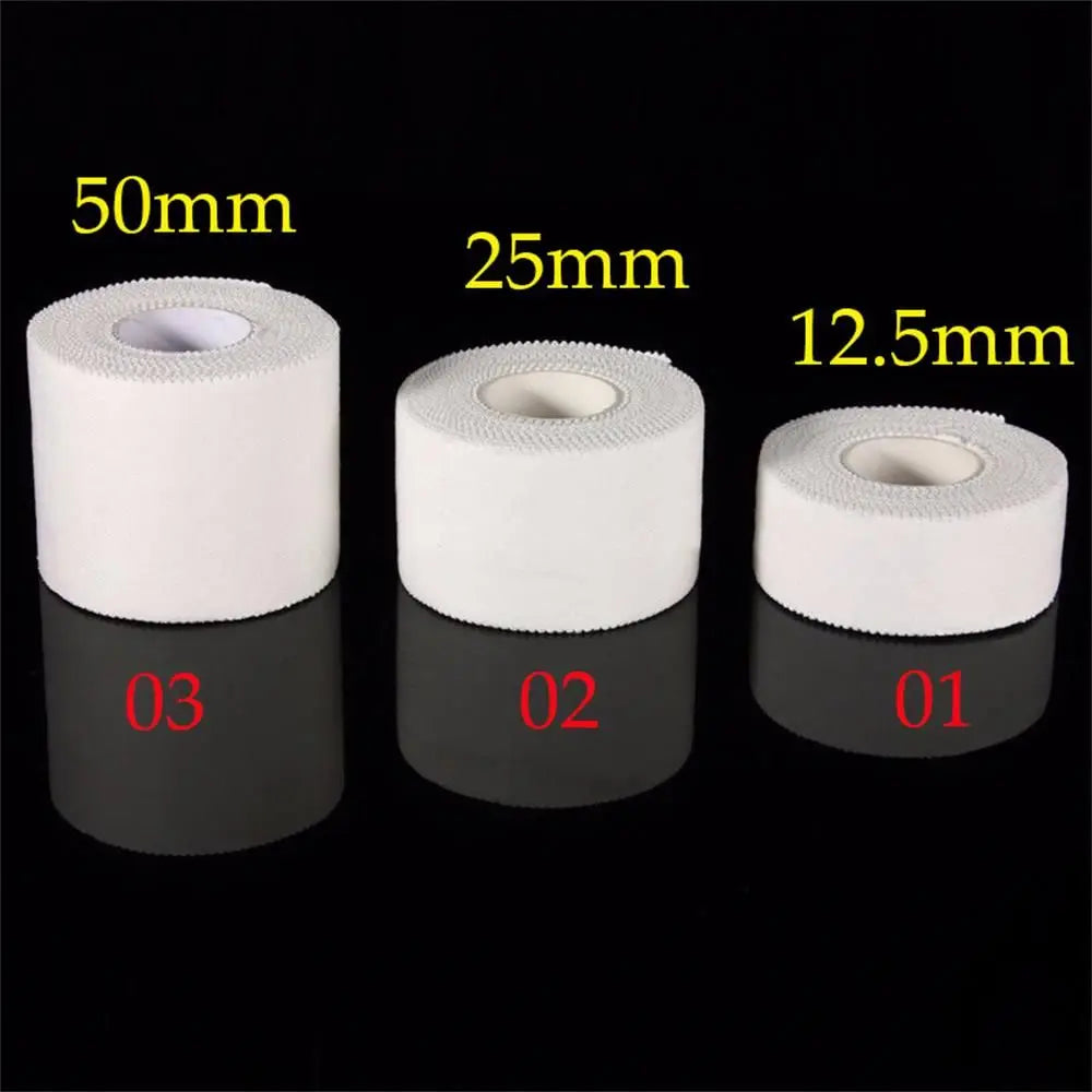 Three rolls of white tape with measurements labeled on a black background