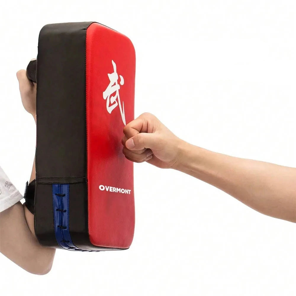 Red and black martial arts training pad with a fist hitting it, on a white background.