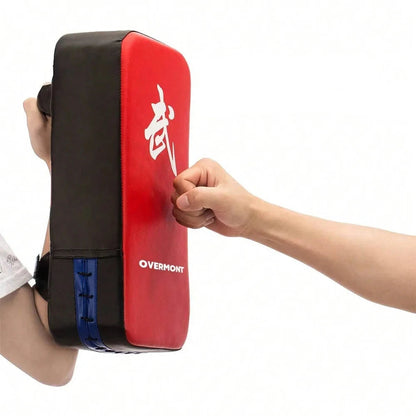 Red and black martial arts training pad with a fist hitting it, on a white background.