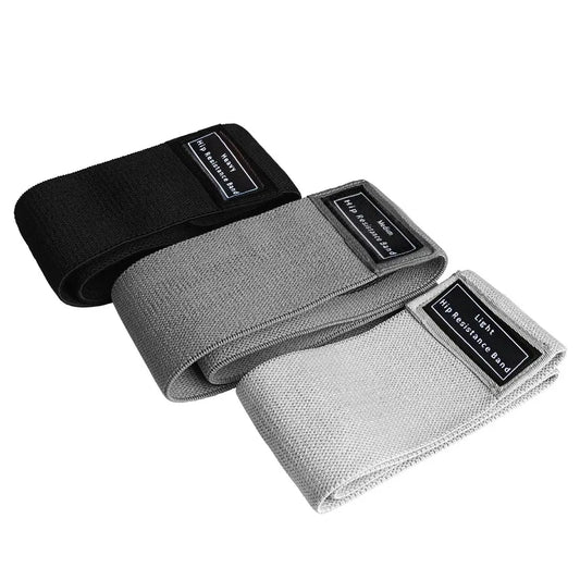 Three resistance bands in black, gray, and white on a white background
