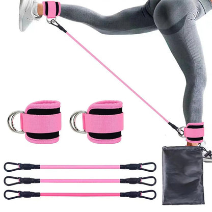 Pink resistance band set with wrist straps and carrying pouch on a white background