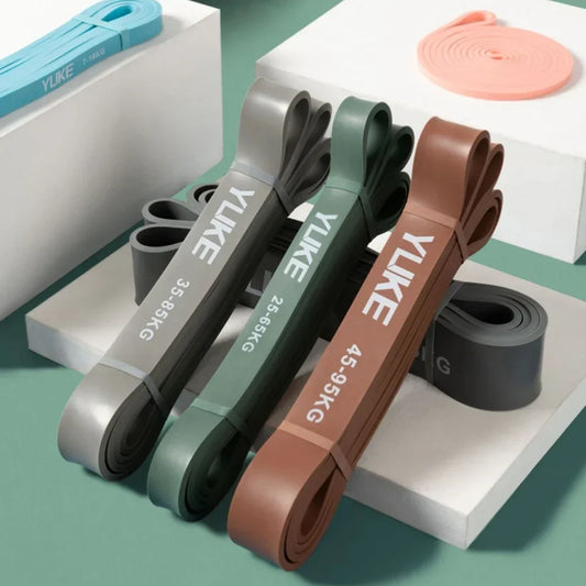 Set of resistance bands with 'Ylke' branding on a green background